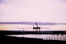 Dusk, showing offshore rig – Click to enlarge